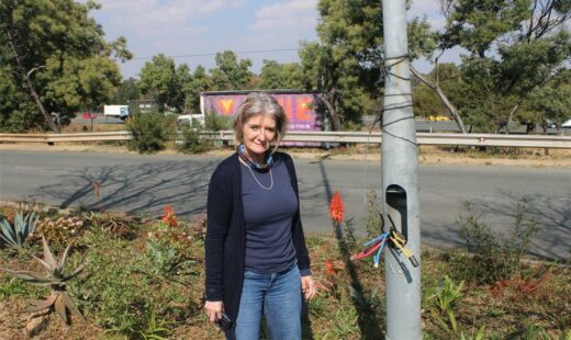 Resident Tracy Kensey stands by the exposed cables of the streetlights along Maxwell Drive on June 25, 2026. Photo: Ayanda Ntshingila