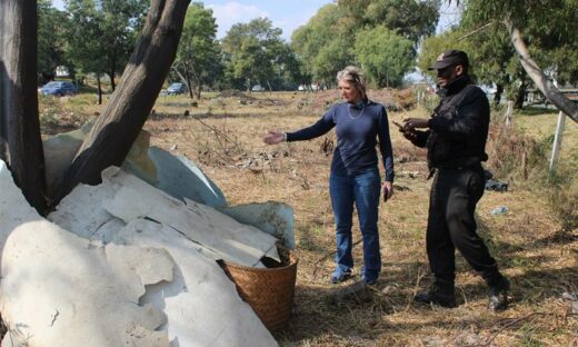 Resident Tracy Kensey and Lawrence Shuma, from Saviki Special Ops, by the informal structure where vadals stay and keep cables on June 25, 2026. Photo: Ayanda Ntshingila