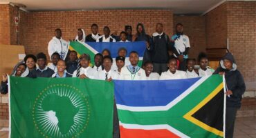 Itirele-Zenzele Comprehensive High School learners hold African flags with pride on June 11, 2026. Photo: Reitumetse Gugushe