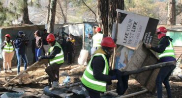 City officials conduct a clean-up initiative at the Clay Oven informal settlement last year after environmental concerns from Paulshof residents. Photo: Ayanda Ntshingila