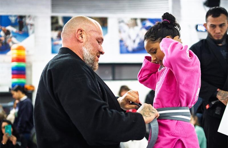 Professor Norman Chef Wessels awards Mehar Nel her grey and white belt during the grading at QuanWessels Brazilian Jiu-jitsu Academy on June 22, 2026. Photo: Supplied