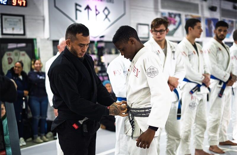 Professor Richie Quan awards John Meso his grey belt during the grading at QuanWessels Brazilian Jiu-jitsu Academy on June 22, 2026. Photo: Supplied