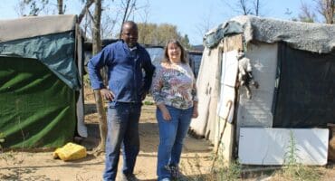 Silent Hlongwane and June Julyan at the informal settlement at the confluence of the Braamfontein and Sandspruit rivers on June 2, 2026. Photo: Ayanda Ntshingila