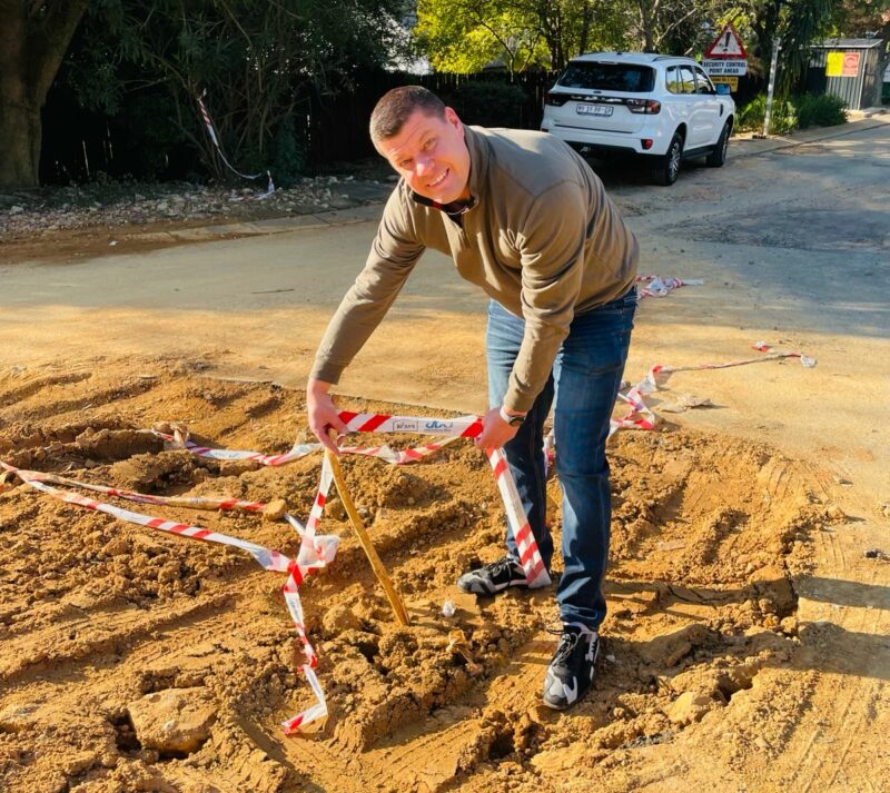Douglasdale resident Chris Neamann at the corner of Westway and Darter Road, where repeated water leaks and ongoing repairs have left infrastructure damage on June 11, 2026. Photo: Ayanda Ntshingila
