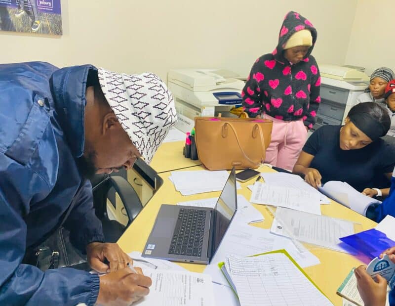 From missing records to complicated administrative processes, many fathers have struggled to secure documentation for their children. A community outreach initiative aims to change that.