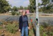 Resident Tracy Kendey stands by the exposed cables of the streetlights along Maxwell Drive on June 25, 2026. Photo: Ayanda Ntshingila