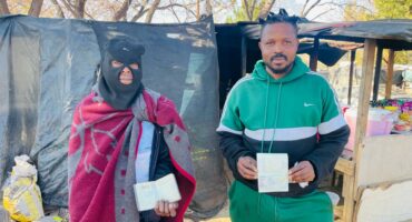 Ginger Park residents Tello Shadrake and Lililoro Pitsho show their passport amid reports of planned anti-migration marches. Photo: Ayanda Ntshingila