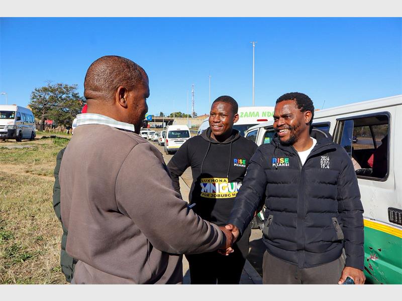 : Rise Mzansi mayoral candidate Lukhona Mnguni engages directly with taxi operators at the intersection of Witkoppen Road and Winnie Mandela Drive on June 5, 2026. Photo: Supplied