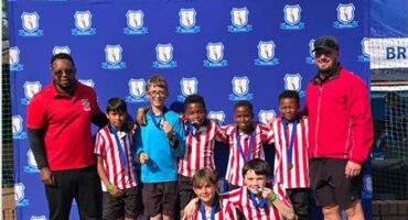 Crawford International Lonehill Preparatory U11 soccer team with their coaches. Photo: Supplied