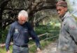 Ward 94 councillor David Foley and Brian Masemola measure a pedestrian walkway to assess whether it could be adapted for vehicle access on June 18, 2026. Photo: Ditiro Masuku