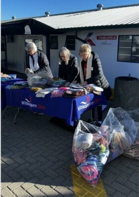 Cedar Lakes KnitWits members Cathy van den Heever, Sue Hockey, and Bernadette Oliphant deliver kindness at Witkoppen Clinic on July 16, 2026. Photo: Ayanda Ntshingila