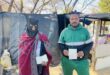 Ginger Park residents Tello Shadrake and Lililoro Pitsho show their passports amid reports of planned anti-migration marches. Photo: Ayanda Ntshingila