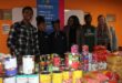 Crossing Cares staff, along with Nova Pioneer learners and the Dean of Students, are showing the food parcels the parents helped gather for the food drive on July 10, 2026. Photo: Reitumetse Gugushe