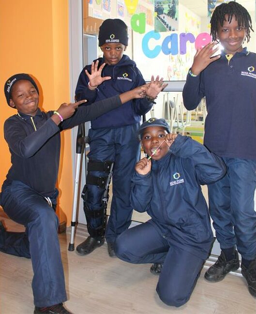 Phenyo Pesha, Olwethu Mdluli, Sanchez Muhonde and Funwako Buthelezi showing their Nova care sign they made on July 10, 2026. Photo: Reitumetse Gugushe