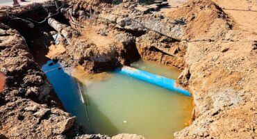 The newly discovered leak, located on a bend in the pipeline encased in concrete, has delayed the road reopening. Photo: Supplied