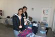 Volunteers Daiah munsamy and Sahuri munsamy folding donated clothes during the Mandela day pop-up donation centre at Cedar Square. Photo: Ayanda Ntshingila