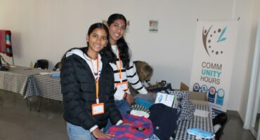 Volunteers Daiah munsamy and Sahuri munsamy folding donated clothes during the Mandela day pop-up donation centre at Cedar Square. Photo: Ayanda Ntshingila