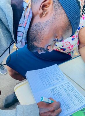 Sydney Morabe signs the memorandum presented at the police station on July 16, 2026. Photo: Reitumetse Gugushe