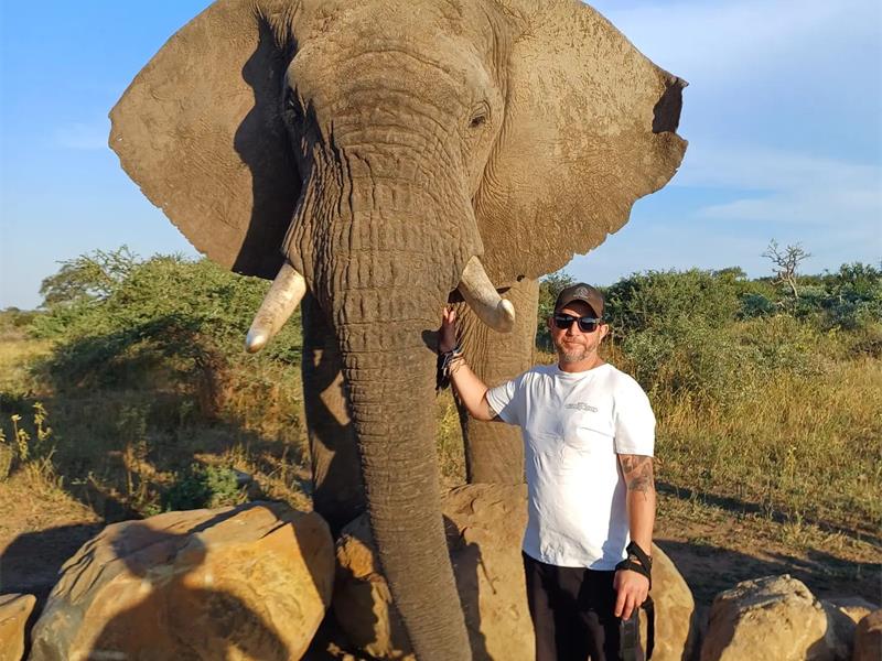 Kyle Malyon with the elephants from the Herd Trust. Photo: Supplied