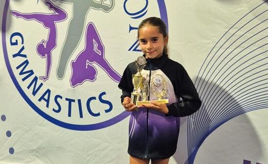 Eleven-year-old Gianna Menikou is proving that hard work, determination, and a love for gymnastics can take young athletes to new heights as she prepares for the upcoming districts competition.