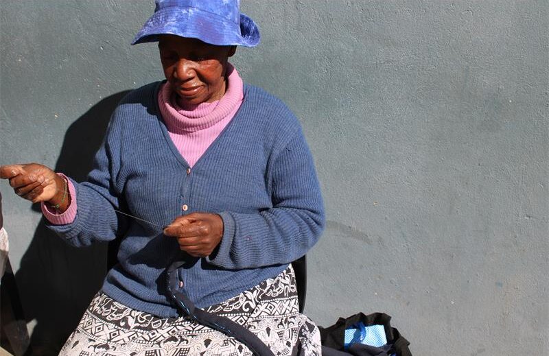 Ester Schoemay sews a bag during their gathering on July 17, 2025. Photo: Ayanda Ntshingila