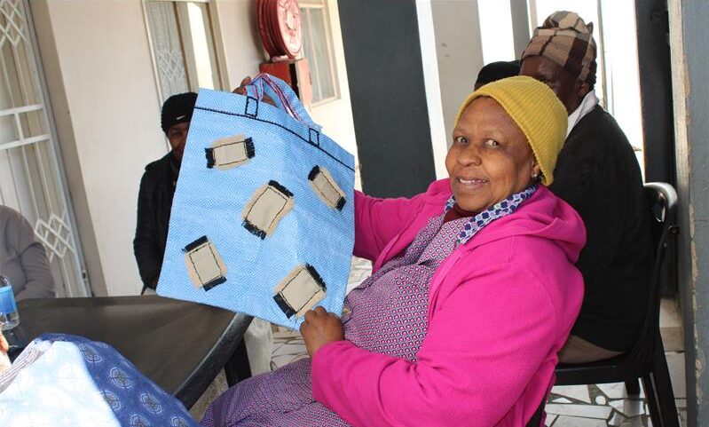 Rachel Wanyane, a member of the Tshwarafa Oldie Club, showcases her work, which she did during the club's daily meeting on July 17, 2026. Photo: Ayanda Ntshingila