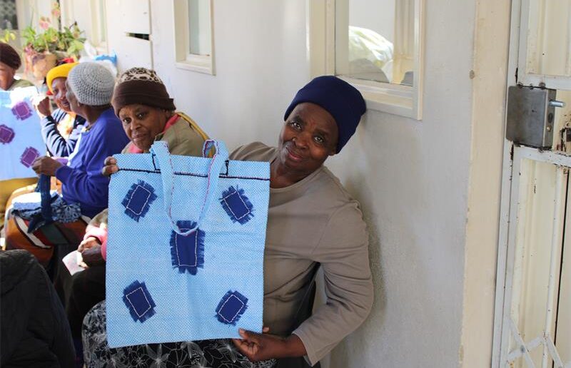 Rachel Madisha, a member of the Tshwarafa Oldie Club, showcases her work, which she did during the club's daily meeting on July 17, 2026. Photo: Ayanda Ntshingila