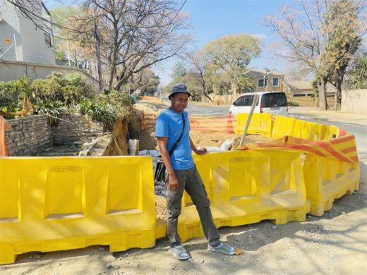 Resident Themba Ndlovu stands at the remaining construction in Duff Road during a site visit to the Craigavon sewer infrastructure project on July 30, 2026. Photo: Ayanda Ntshingila