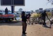 Metro police officers remove structures and belongings during an operation to clear an illegal occupation near Tiger Wheel & Tyre on Winnie Mandela Drive. Photo: Supplied