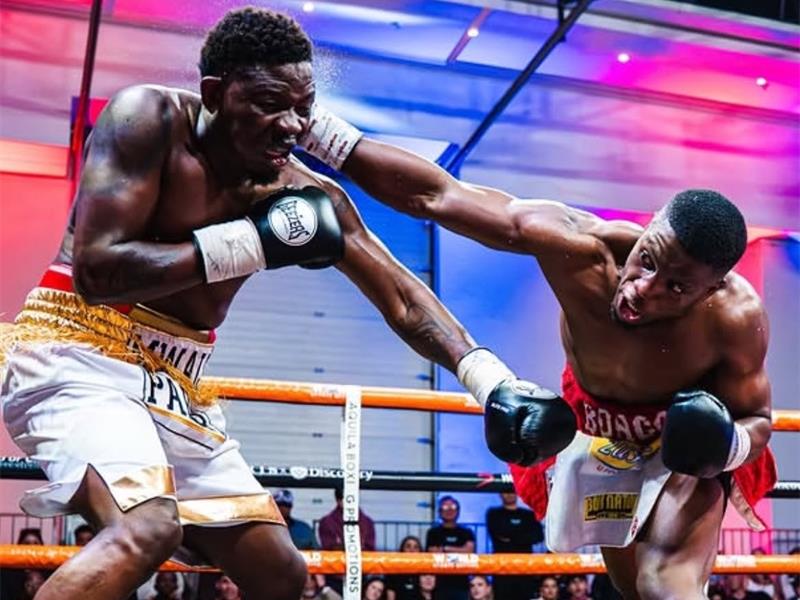 Denis Mwale takes a right hand from Simnikiwe Bongco at the Aquila boxing promotions event in Sandton on July 25, 2026. Photo: Supplied