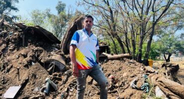 Ward 93 councillor Vino Reddy stands in front of debris, including a mattress, found during the clean-up operation at the Sunninghill Taxi Rank on September 10, 2026. Photo: Ditiro Masuku