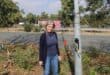 Resident Tracy Kensey stands by the exposed cables of a streetlight along Maxwell Drive in Sunninghill on June 25, 2026. Photo: Ayanda Ntshingila