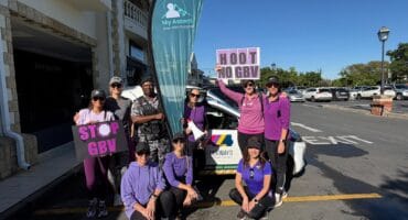 The group of women, who joined the community walk, stand together in purple in support of victims and survivors of gender-based violence on October 1, 2026. Photo: Ayanda Ntshingila