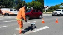 Kholofelo Maitisa paints fresh road markings outside Dainfern Square on October 22, 2026. Photo: Ditiro Masuku