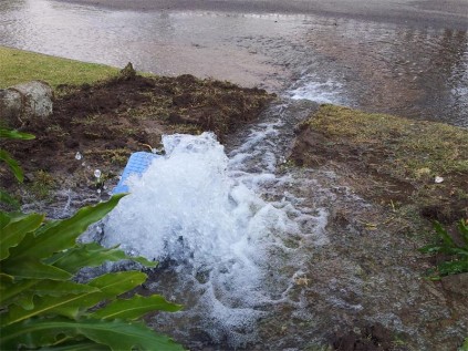 Reported pipe burst was flowing with water the entire Friday afternoon.