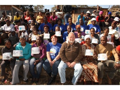 Seen here are the solar light beneficiaries with Erick Dorner and Hilary Coke.