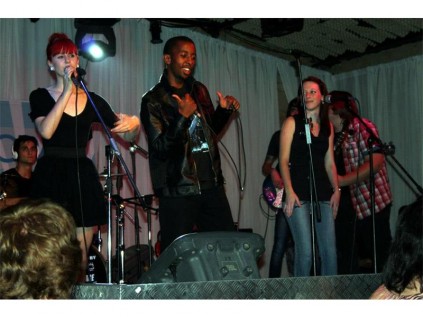 Domnique performing with her band.