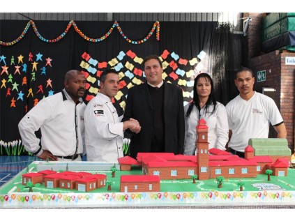 Cake makers Solomon Sindane, Cake master Paul Vieira, Headmaster Roger Loring, and Pauls wife Suzette Vieira at St Dominics 90th Birthday Celebration