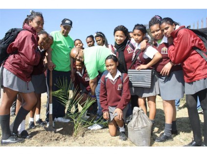 Seen are the school children and members of Atmosphere Changers’ planting trees at Reiger Park Secondary School. The aim is to educate and make the youth aware of the benefits and the importance trees play in the circle of life.