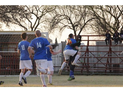 Boksburg goalkeeper, Tefo Tladi (Sinis Ta YoGii), celebrates with centre back Matthew Cooley after making the decisive penalty save.