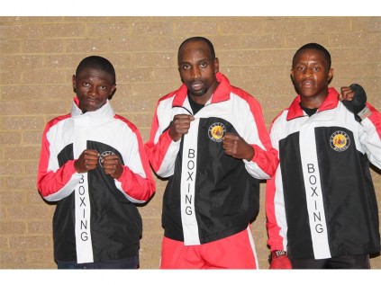 These boxers from the Boksburg Amateur Boxing Club have done well. They are (from left) Bongani Zingange and Lifa Gxabuza. With them is, coach Michael Fortuin (middle).