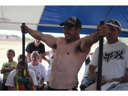 Kotze hanging on for dear life in the concluding Ultimate strength exercise - the straight-arm crucifix hammer hold.