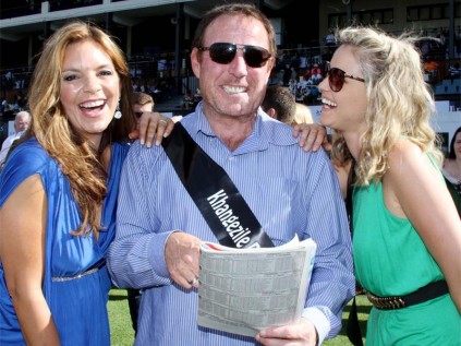Owner of online station Ballz Visual Radio, Darren Scott gives entertainer, Amor Vittone and the former face of Wonderbra, Kerry  McGregor some horse racing tips at Saturday’s (November 2) Peermont Emperors Palace Charity Mile at Turffontein Racecourse. Scott and the two lovely ladies were three of the 16 celebrities who supported this major event on the South African horse racing calendar which annually brings some of the country’s best known personalities together with 16 top-class race horses