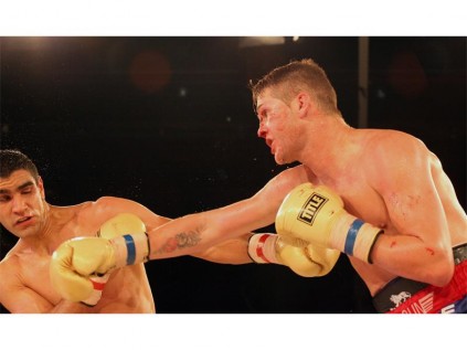 "Tommy Gun" (right) outlasted Argentine, Ezequiel Maderna (left) to successfully defend his IBO Super Middleweight world title at Emperors Palace. Photographer: Debbie Yazbek. (November)