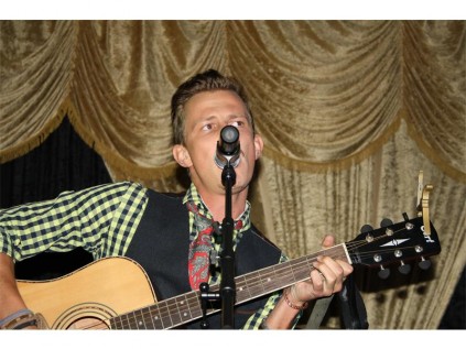 Entertaining the crowd is singer Romme Jones.