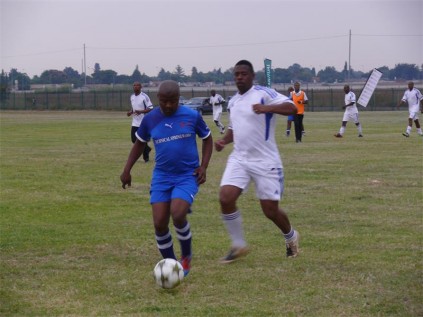 On the ball is Themba Zondo, of the winning team. He also received a trophy for being Man of the Match.