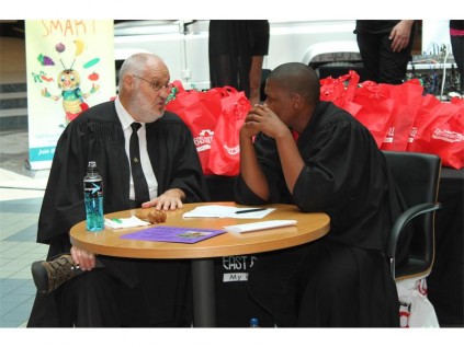"Judge" Beyers de Klerk and Sizwe Sibiya, who acted as the prosecutor, discuss the fates of the "convicts".