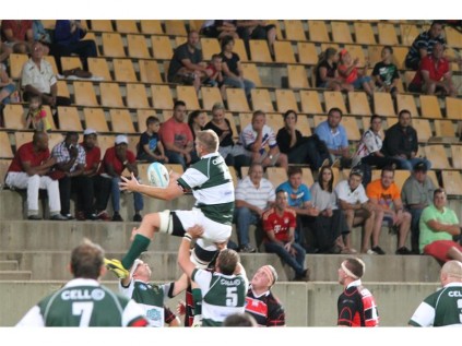 Big boys do battle in the line-out as the crowd watches on.