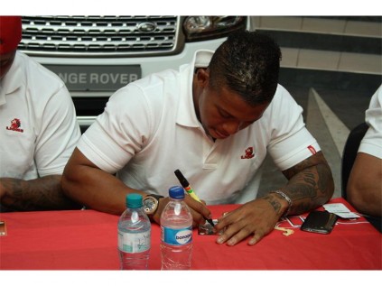Lions and Springbok flyhalf Elton Jantjies signing his autograph.