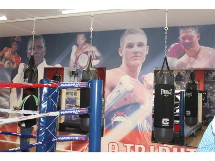 Featured inside are artistic and historic boxing displays on the walls.